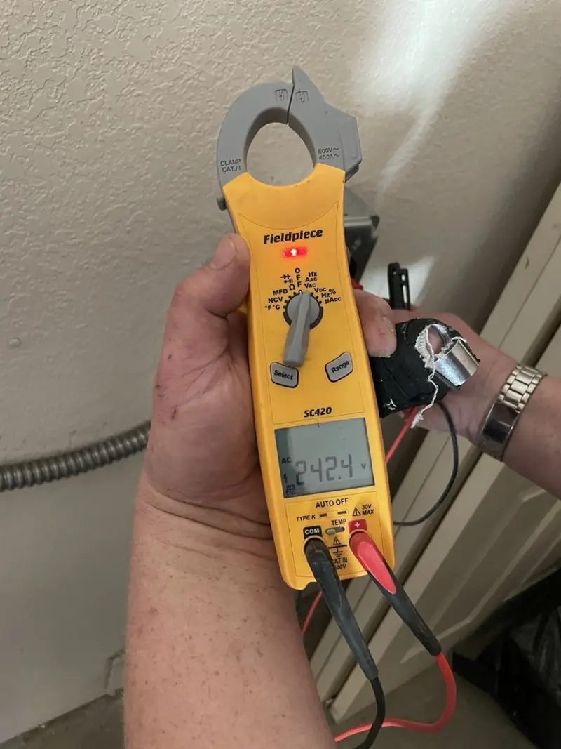 Voltage testing with clamp meter during Outlet Installation in Millbrae